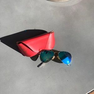 Rayban Aviators with Blue lenses.